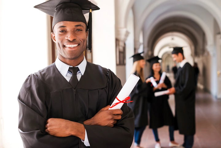 college graduate holding his diploma | Santa Monica Subaru in Santa Monica CA